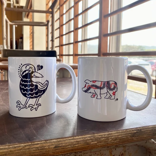 やんばるアートフェスティバル公式グッズ：Chocomoo・BAKIBAKI マグカップ