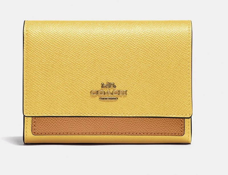 コーチ、黄色×ベージュの財布